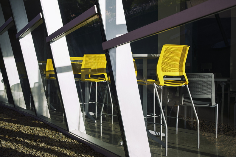 Three_yellow_chairs_behind_glass_1.jpg