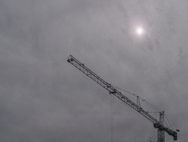 Sun screened by clouds and crane 2