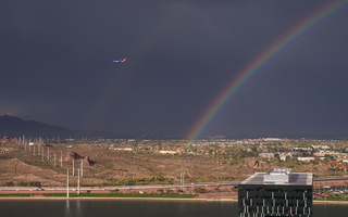 Rainbow with plane over Tempe Town Lake s