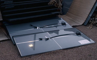 Discarded solar panels with reflection