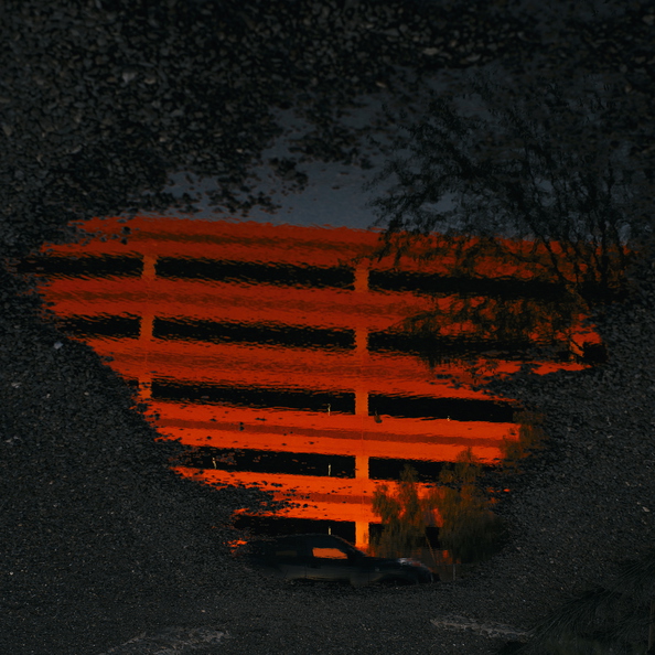 Parking_deck_reflection_sunset.jpg