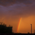 Desert_Rainbow_Against_Orange_Sky.jpg