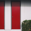 Red_Doors_Green_Bushes.jpg