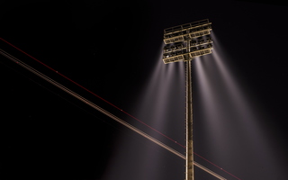 Lighttrail of floodlight and plane 01