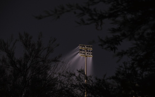 Lighttrail of floodlight and trees
