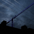 Different_Xmas_lights_lit_crane_power_lines.jpg